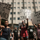 Demonstrators hold “Justice for Jayland” signs as they gather outside Akron City Hall to protest the killing of Jayland Walker, shot by police, in Akron, Ohio, July 3, 2022.